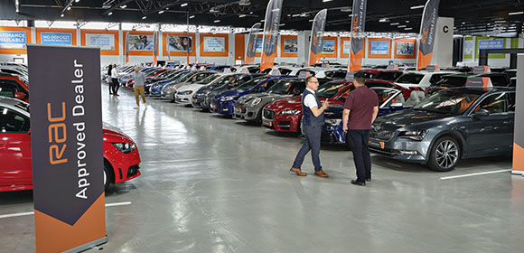 image of a car showroom with RAC Approved Dealer signs displayed
