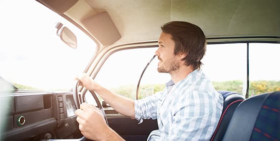 Young man driving a classic car