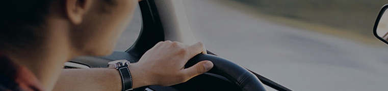 young man driving a car