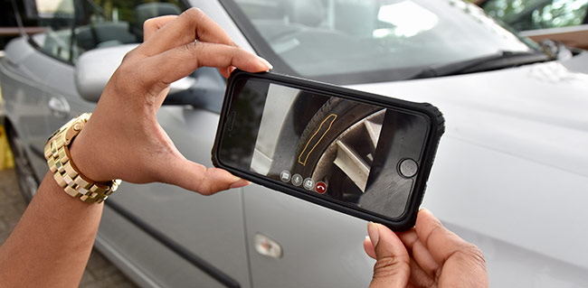 Lady using the remote technician technology image