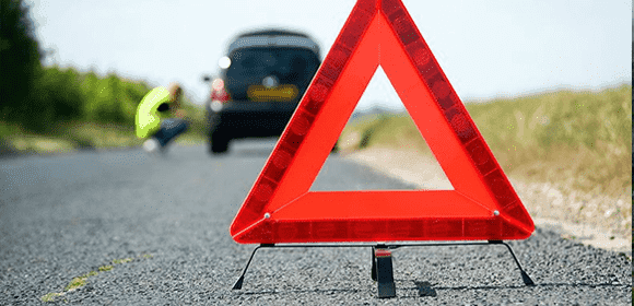 Red warning triangle near a breakdown