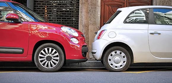 Two cars parked close together