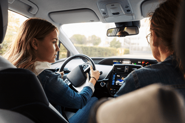 Teenage girl learning to drive.png