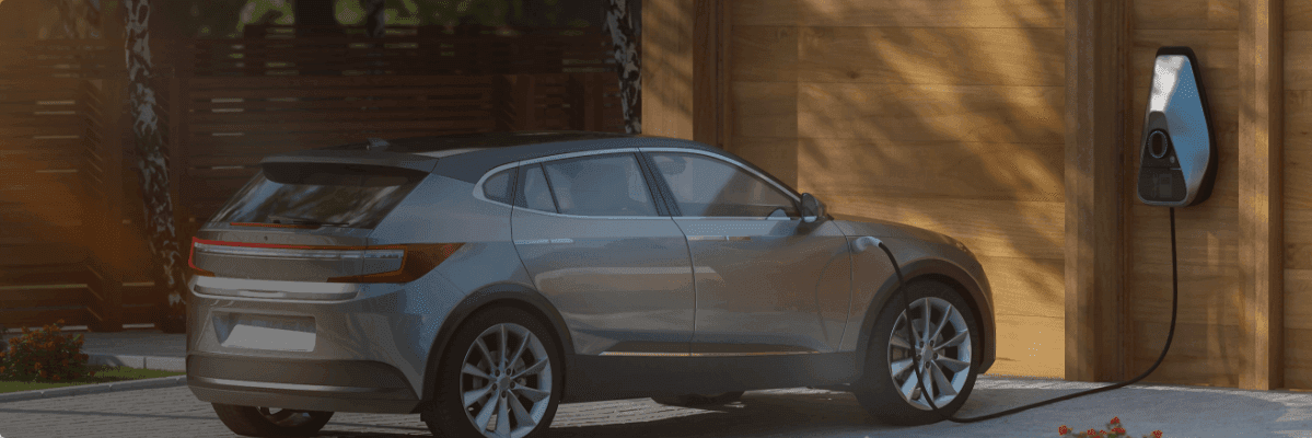 An electric car plugged in charging