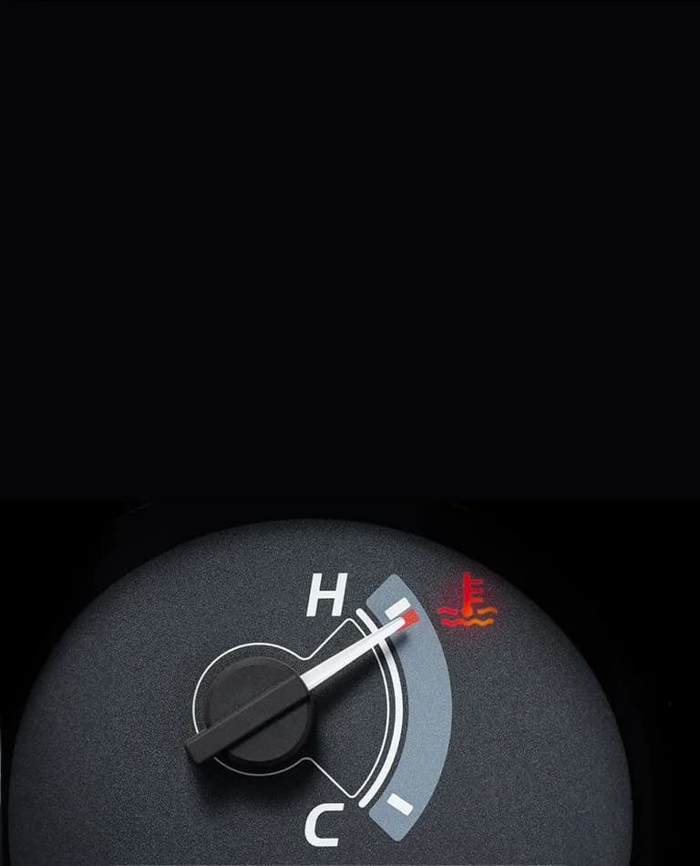 Close up of a car dashboard showing an enginer temperature gauge