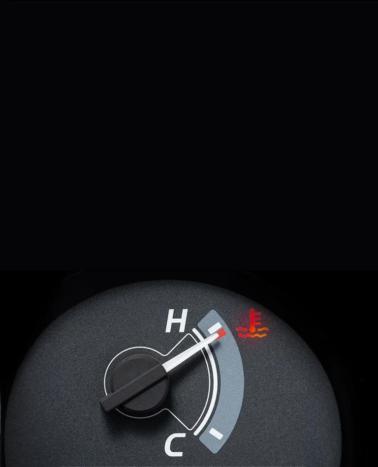 Close up of a car dashboard showing an enginer temperature gauge