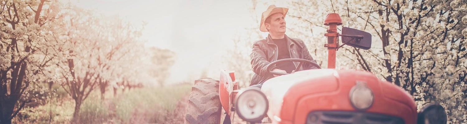 Man driving a classic tractor