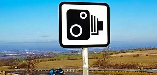 Road sign showing speed cameras ahead