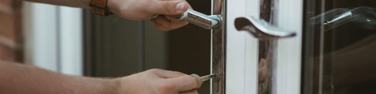 person locking a patio door