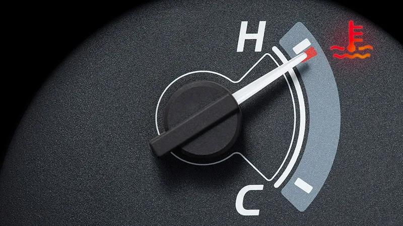 The temperature gauge of a car on a vehicle dashboard