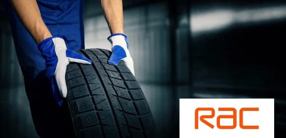 A person holding a tyre