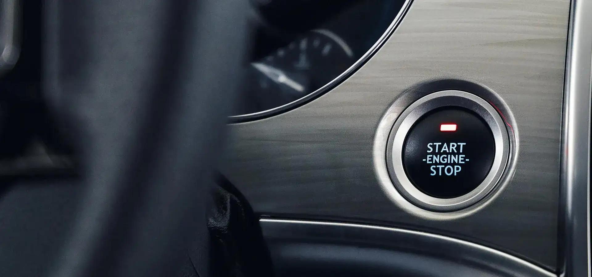 A close up of a stop start engine button for a starter motor