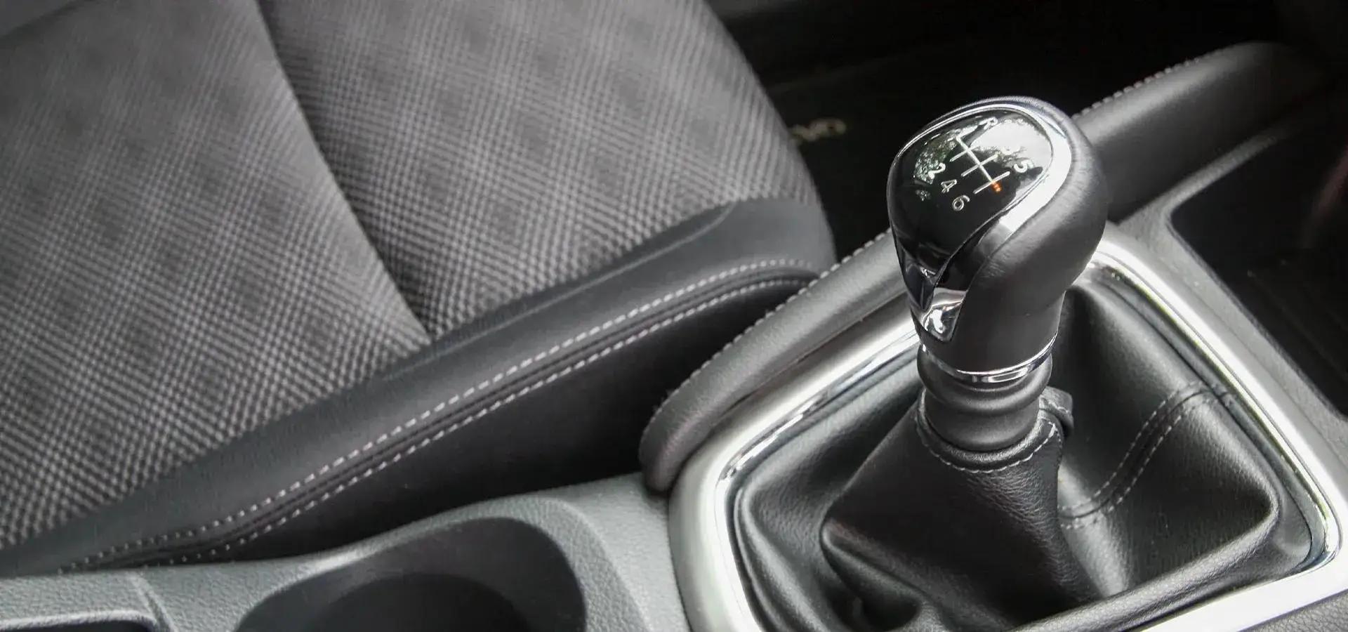 A close-up of a car gearbox stick
