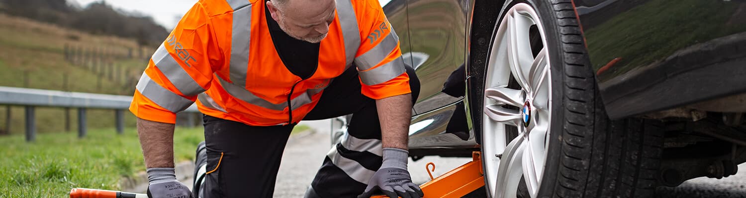 RAC patrol jacking up a members vehicle