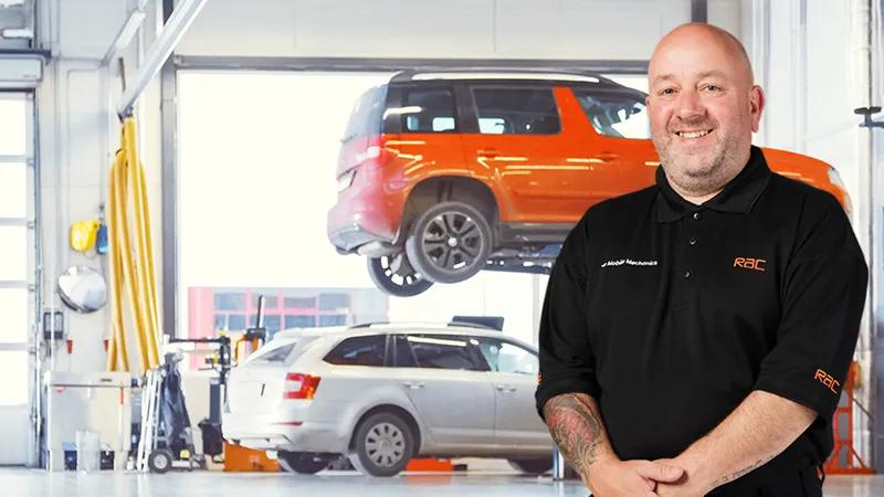 A mechanic standing inside a garage
