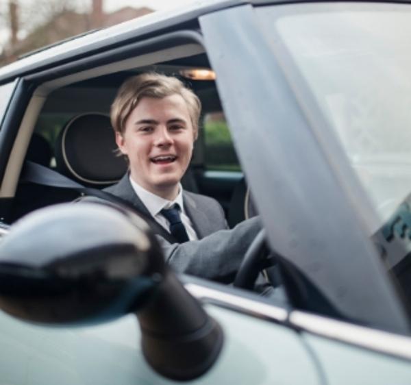 Young business-person in the driving seat