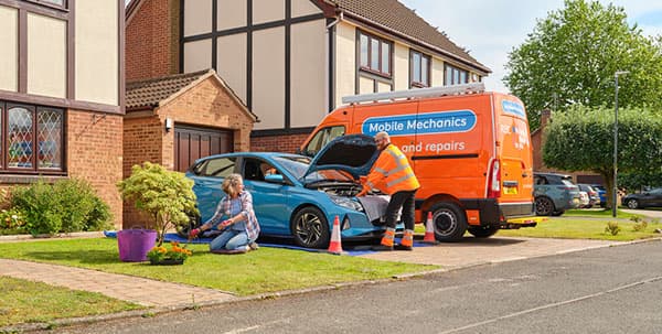 An RAC Mobile Mechanic van parked up outside a customer's house.