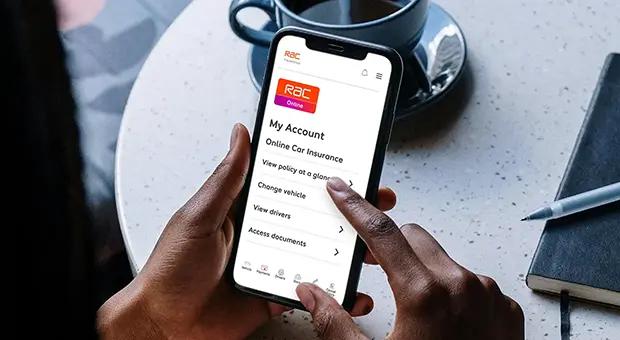 A person holding a phone on the myRAC app