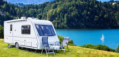 Caravan set up by a lake-side
