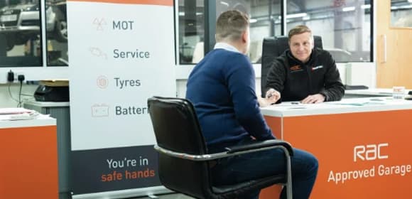 Customer sat with an RAC representative booking a service