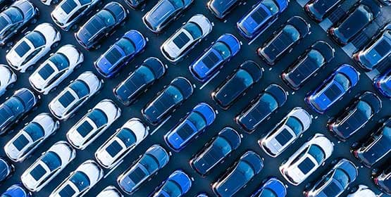 car park full of white and blue vehicles