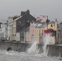 Rain and large waves disrupt travel