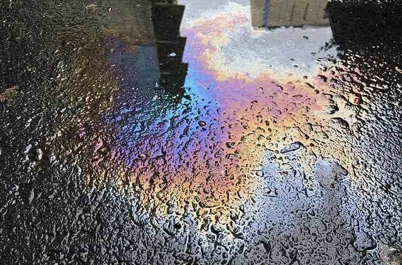 car dripping oil spill