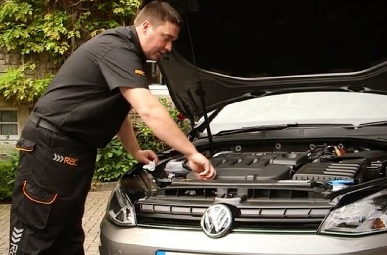 rac mechanic checking under car bonnet