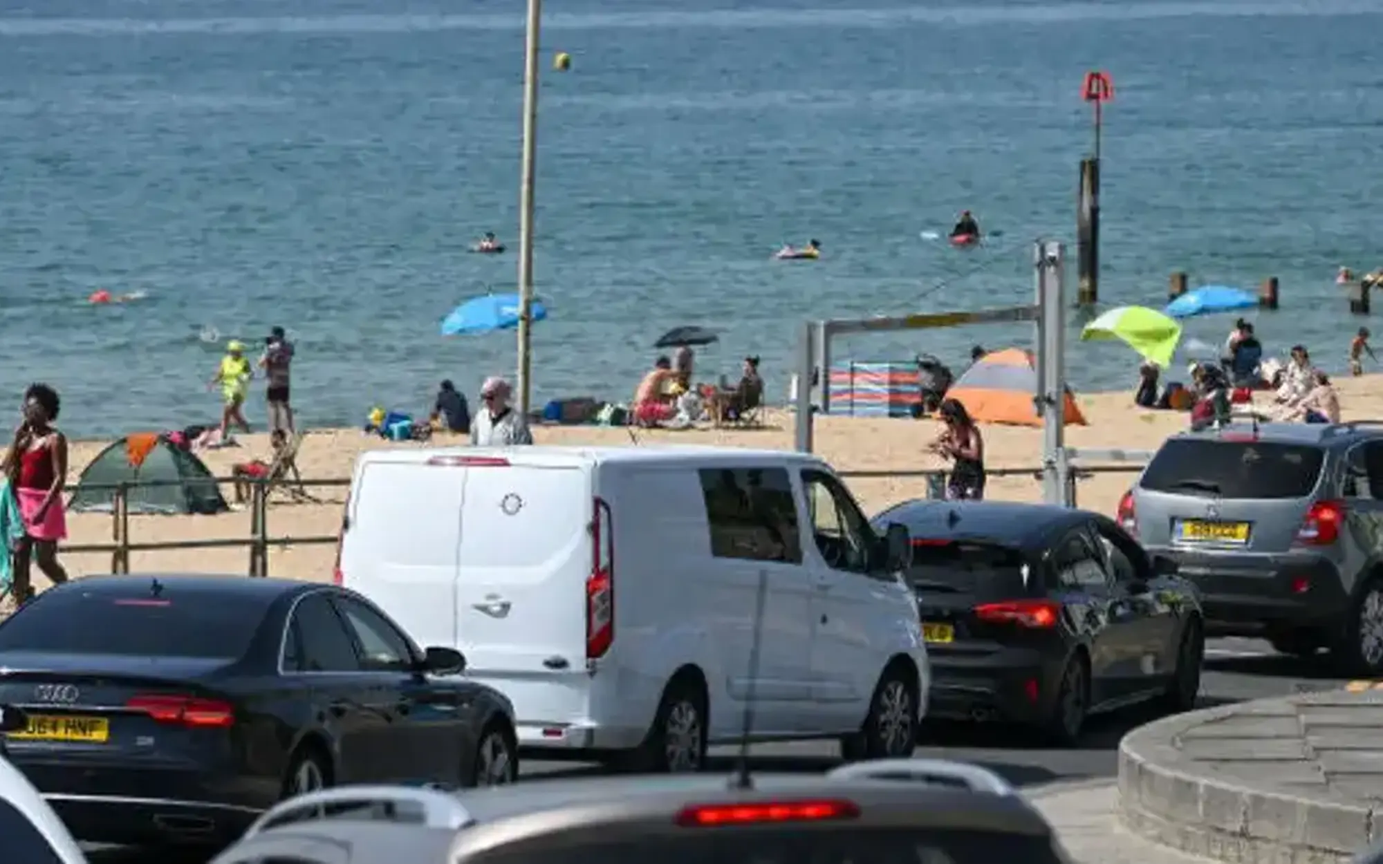 Vehicles in queue at seaside because of heatwave
