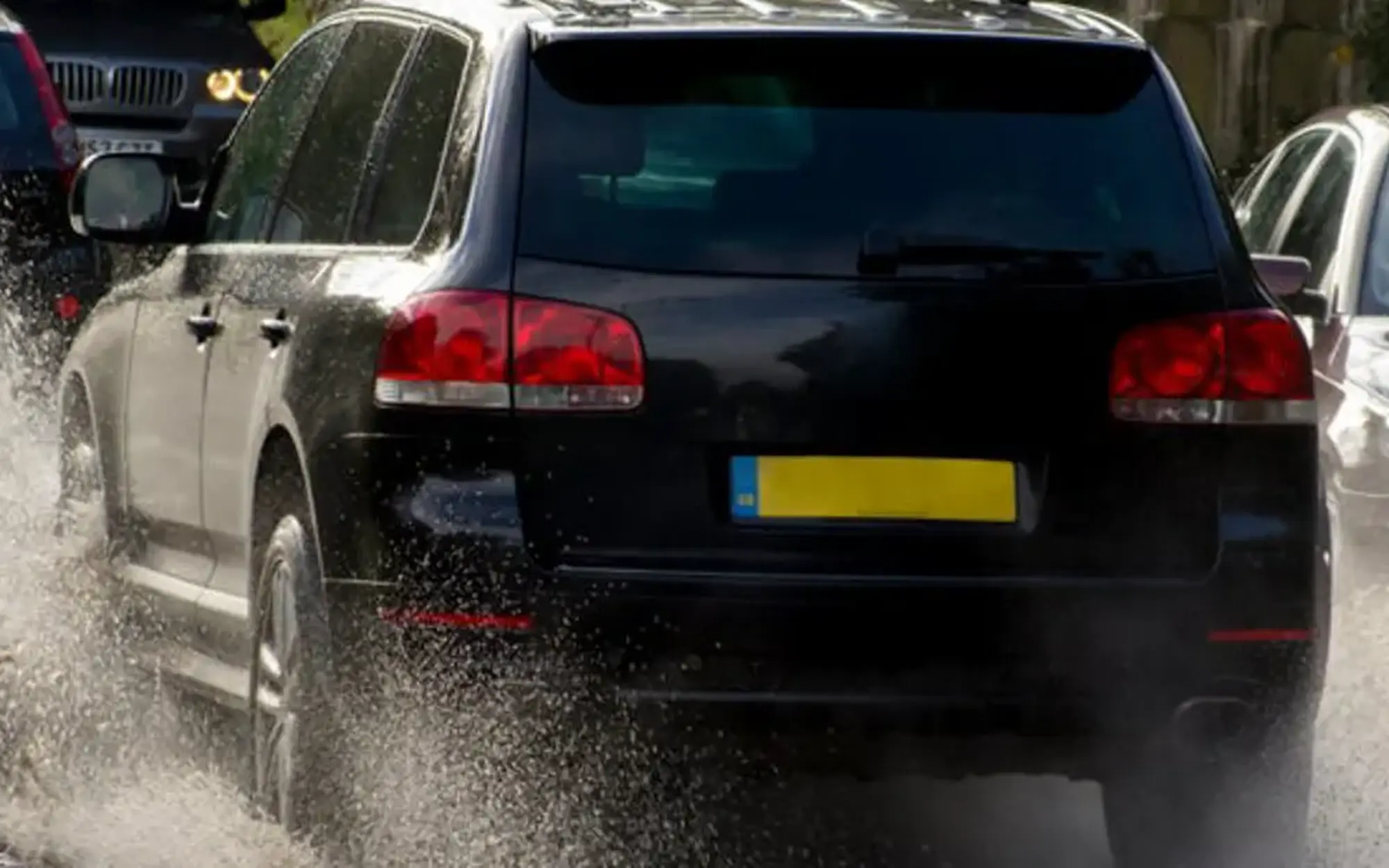 Car driving through flood