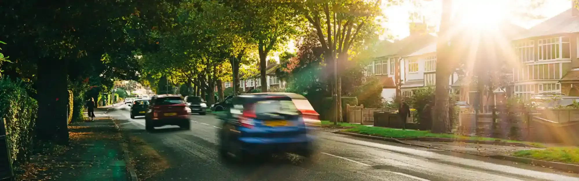 Cars driving in sunlight